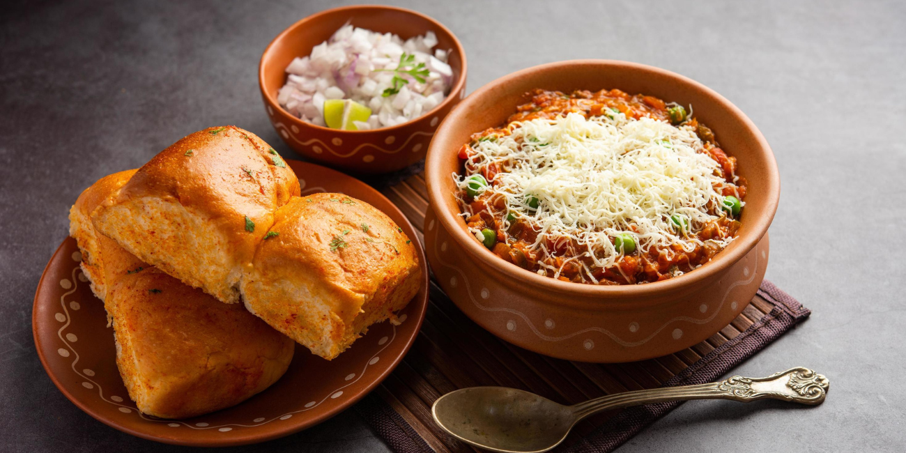 Cheese topped pav bhaji